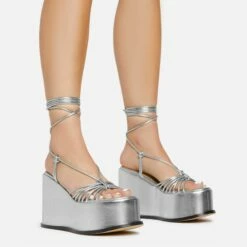 Front Page 57 EGO Bubblegum Lace Up Knotted Strap Detail Platform Wedge Heel In Silver Metallic Faux Leather