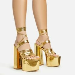EGO Amazoness Lace Up Extreme Strappy Detail Platform Block Heel In Gold Patent
