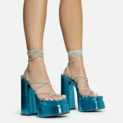 EGO Star-Walker Lace Up Diamante Knotted Strap Detail Extreme Platform Block Heel In Blue Metallic Faux Leather