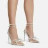 EGO Pearlle Diamante Bow Detail Clear Perspex Pointed Toe Stiletto Heel In White Faux Leather